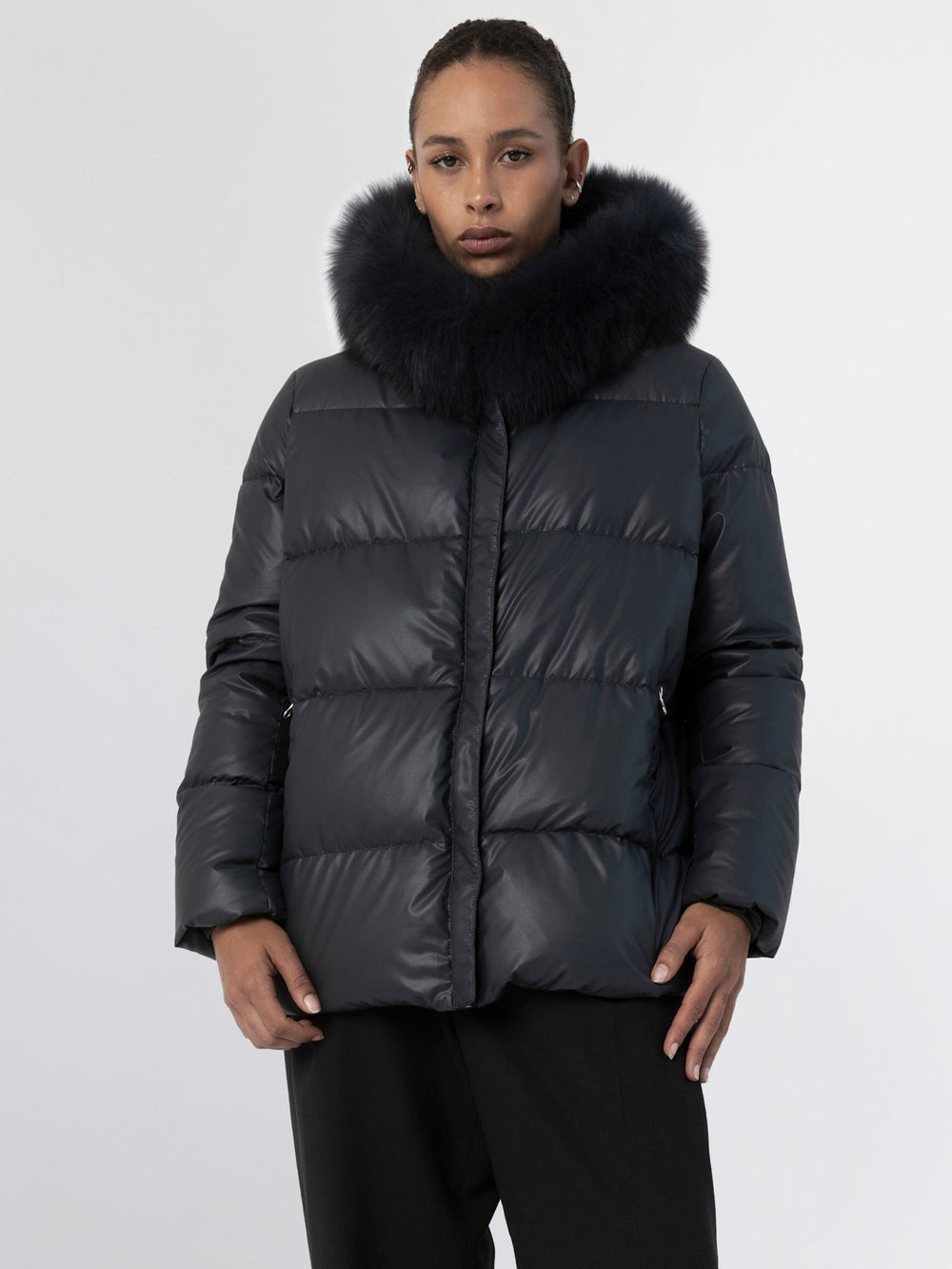 Stylish black puffer jacket with a luxurious fur collar, perfect for winter, featuring a modern fit by MEOTINE.