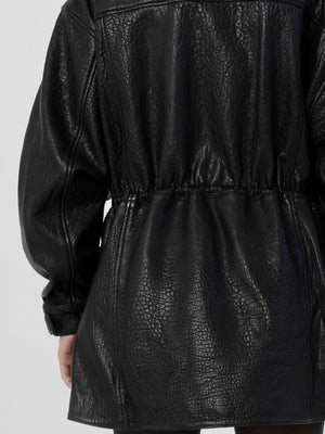 Black leather jacket with a cinched waist and textured finish, showcasing a stylish and modern design by MEOTINE.