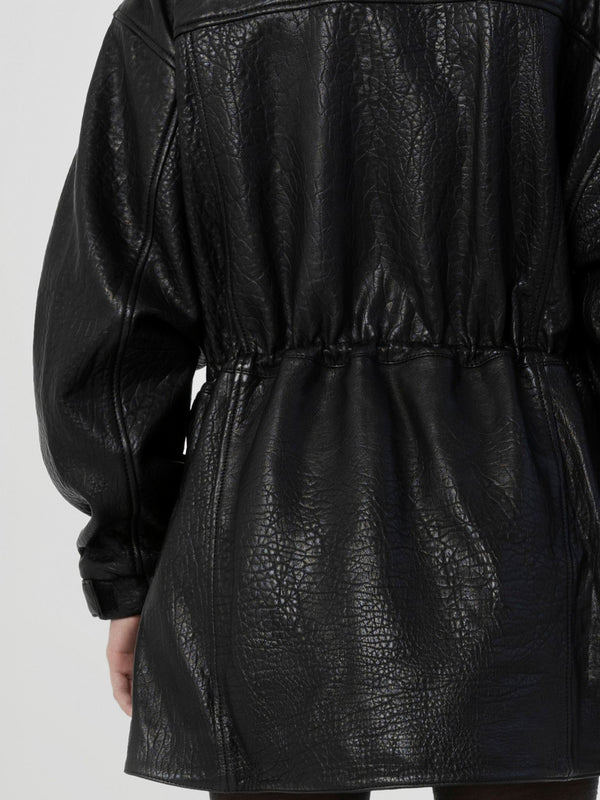 Black leather jacket with a cinched waist and textured finish, showcasing a stylish and modern design by MEOTINE.