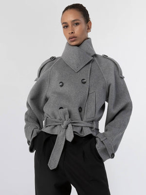Stylish gray trench coat with a belted waist and double-breasted design, showcasing a modern look by MEOTINE.