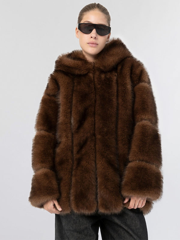 A model wearing a luxurious brown faux fur coat with a hood, styled with sleek black sunglasses, showcasing MEOTINE's elegance.