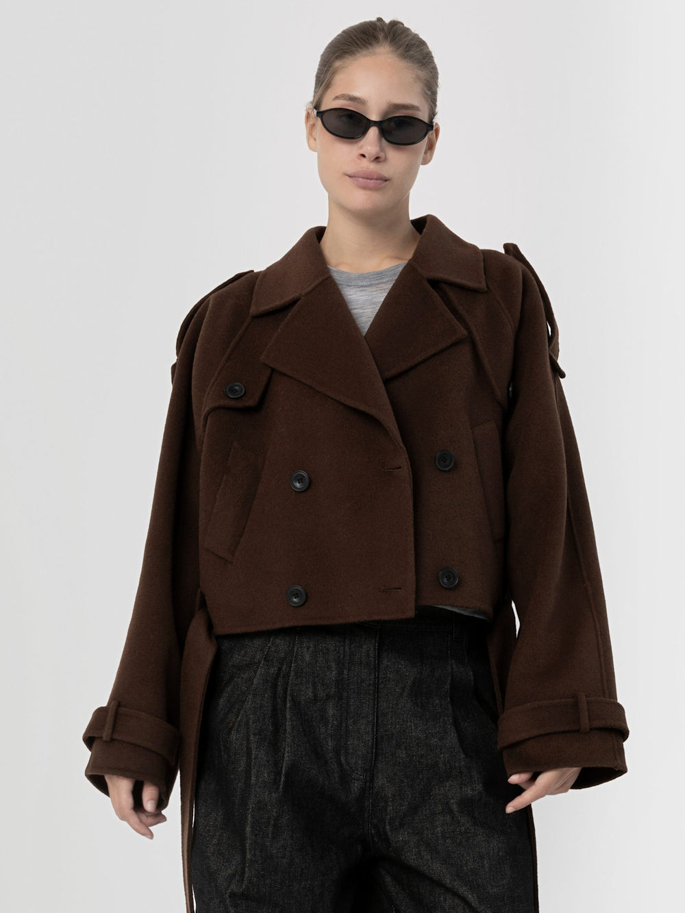 Stylish brown cropped double-breasted coat with oversized sleeves, paired with sleek sunglasses, showcasing MEOTINE's modern design.