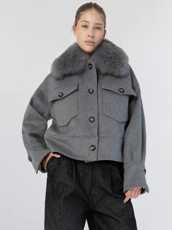 Stylish gray cropped jacket with a plush fur collar, featuring buttoned pockets, perfect for a chic winter look by MEOTINE.