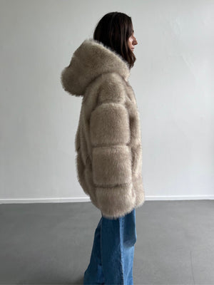 Cozy beige faux fur jacket with a hood, featuring a puffy design, perfect for stylish warmth by MEOTINE.