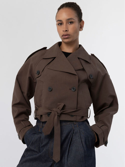 Stylish brown cropped trench coat with a belted waist, featuring double-breasted buttons, by MEOTINE. Perfect for a chic look.