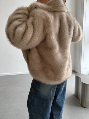 Cozy beige faux fur jacket from MEOTINE, styled with relaxed denim jeans, showcasing a soft and luxurious texture.