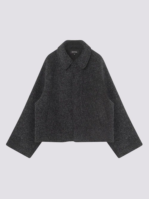 Stylish dark gray cropped jacket with a classic collar and wide sleeves, perfect for a chic, modern look by MEOTINE.