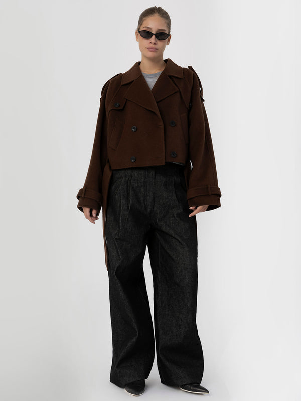 A model showcases a stylish brown cropped double-breasted jacket paired with wide-leg black trousers, embodying MEOTINE's chic aesthetic.