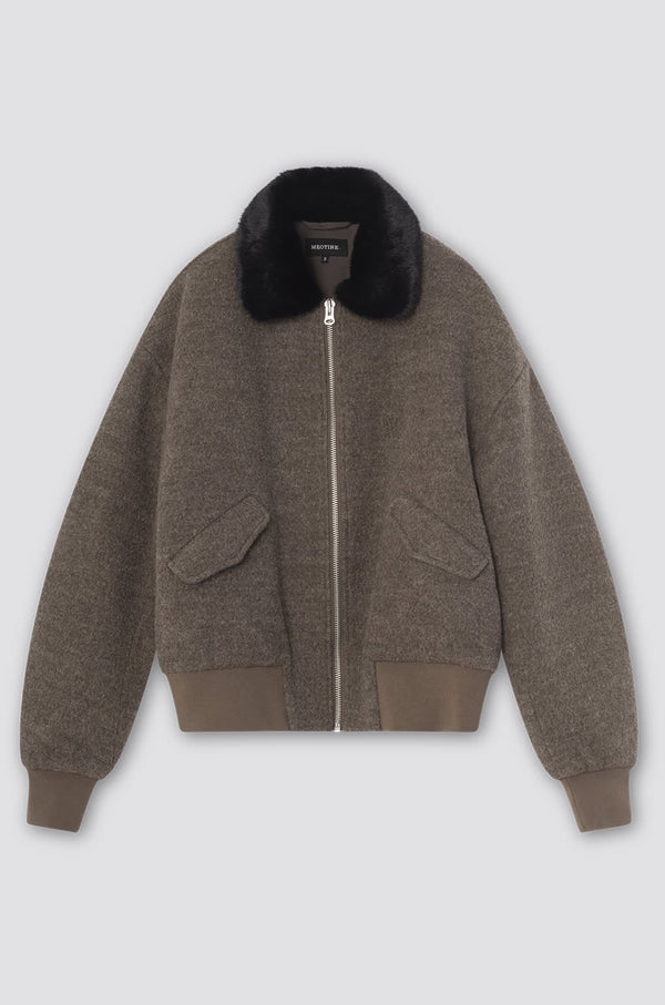 Cozy brown bomber jacket with a faux fur collar and side pockets, perfect for stylish warmth. MEOTINE offers chic comfort.