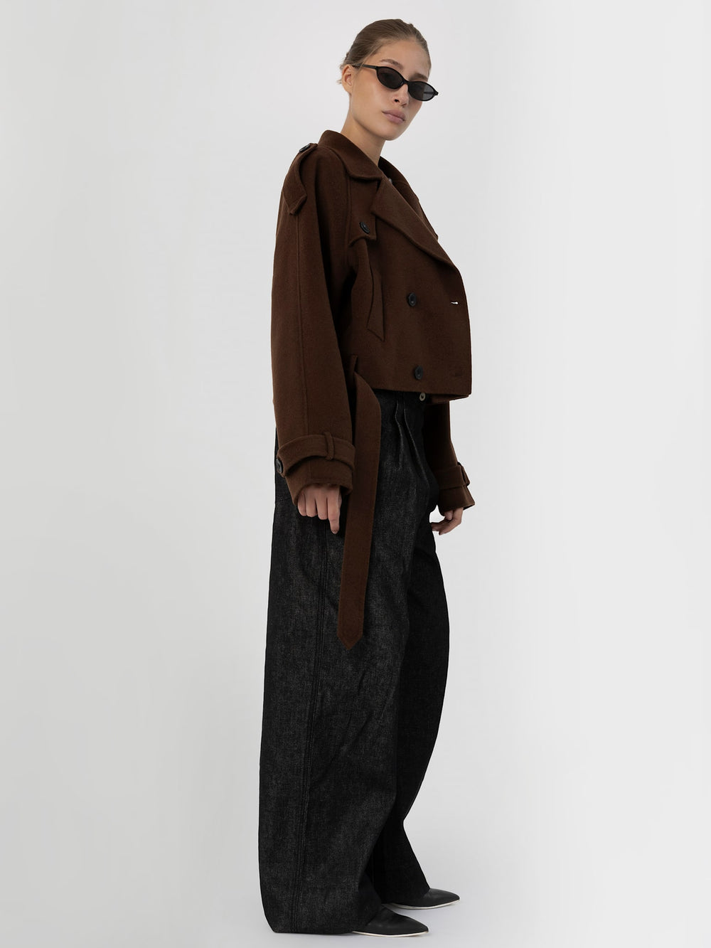 Stylish brown cropped double-breasted coat with oversized sleeves, paired with sleek sunglasses, showcasing MEOTINE's modern design.