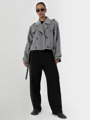 Stylish gray cropped coat with oversized buttons, paired with black wide-leg trousers and sunglasses, showcasing MEOTINE's modern aesthetic.