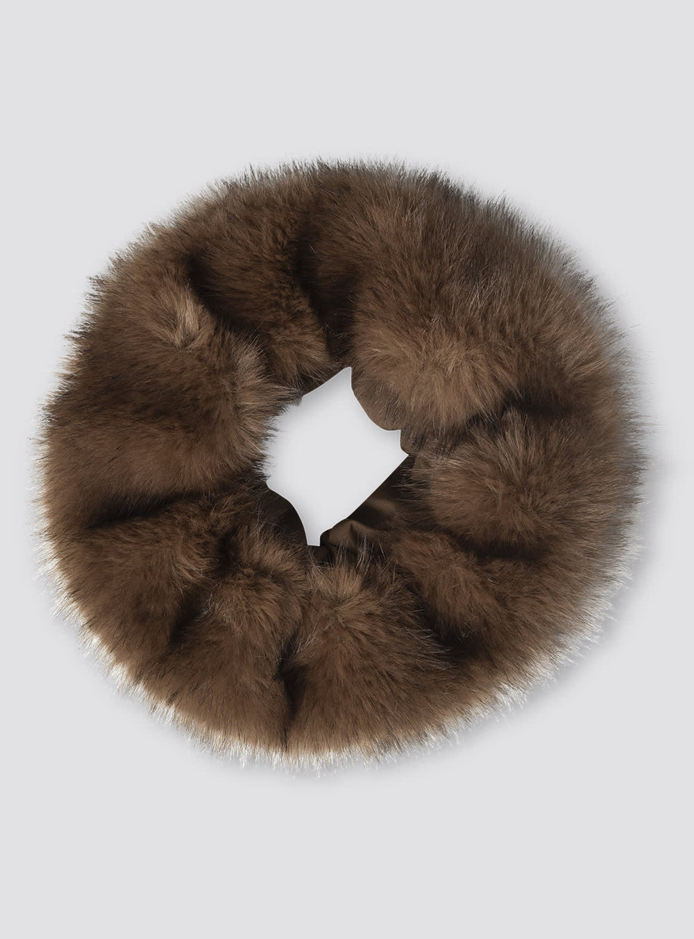 A model wearing a brown fur hat paired with a stylish leather jacket, showcasing MEOTINE's chic winter fashion.