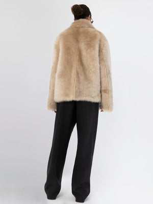 Luxurious beige faux fur coat from MEOTINE, featuring a relaxed fit and elegant design, perfect for stylish winter layering.