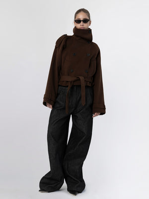 A model showcases a stylish brown oversized coat with a belt and high collar, paired with wide-leg black pants, embodying MEOTINE's chic aesthetic.