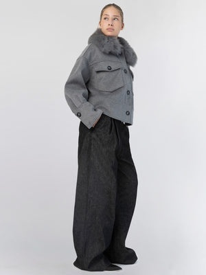 A model showcases a stylish gray cropped jacket with a fur collar, paired with wide-leg black pants, embodying MEOTINE's chic aesthetic.