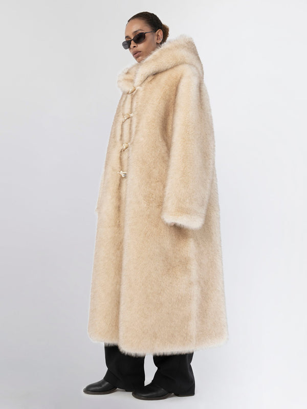 Luxurious beige faux fur coat with a hood, featuring a relaxed fit and stylish toggle closures, perfect for winter by MEOTINE.