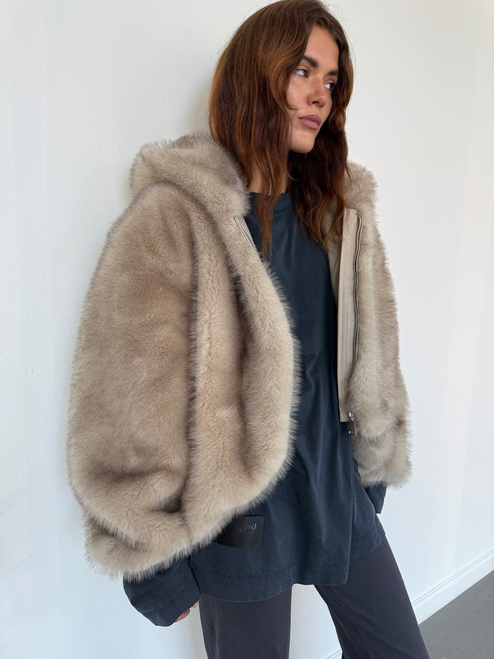 Cozy beige faux fur hoodie jacket with a zip closure and a soft interior, perfect for warmth and style by MEOTINE.