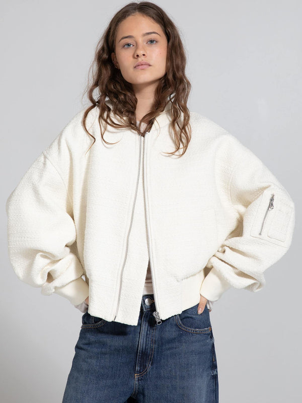 Cozy cream oversized jacket with a zip front and side pockets, perfect for a stylish, relaxed look by MEOTINE.