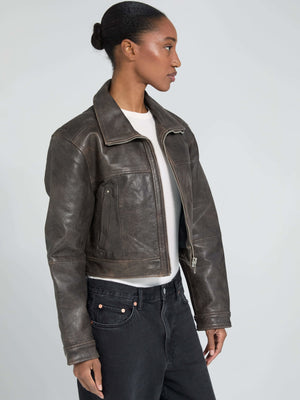 Stylish cropped leather jacket in dark brown, featuring a classic collar and side pockets, perfect for a chic look by MEOTINE.