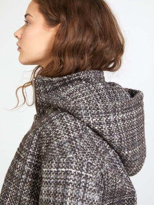 A model showcases a stylish, textured gray hooded jacket by MEOTINE, highlighting its cozy design and modern silhouette.