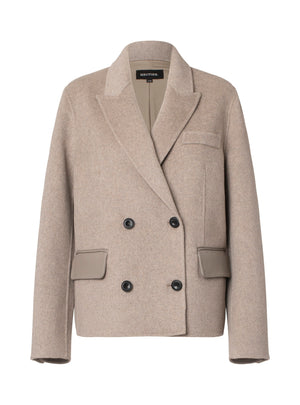 Stylish beige double-breasted blazer with a modern cut and subtle pocket details, perfect for a chic look by MEOTINE.