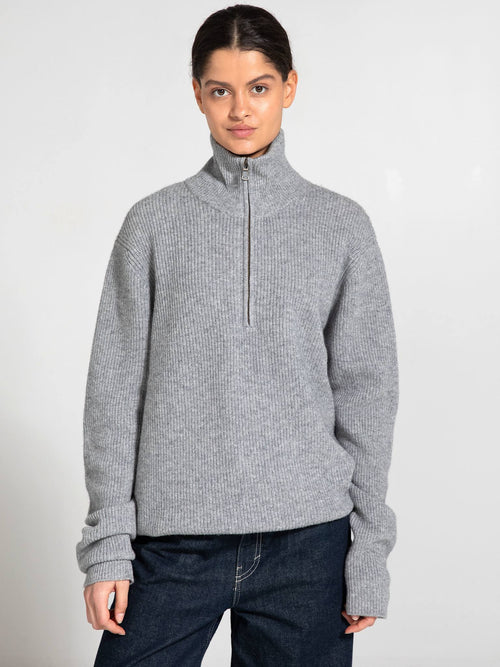 Cozy gray zip-up sweater with a high collar, featuring a relaxed fit and long sleeves, perfect for casual wear by MEOTINE.