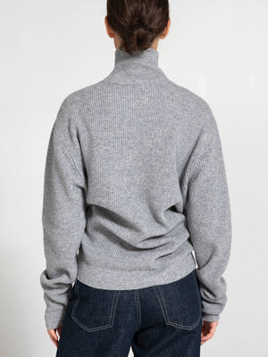 Cozy gray turtleneck sweater with a relaxed fit, perfect for layering. Ideal for casual outings or lounging at home. MEOTINE.