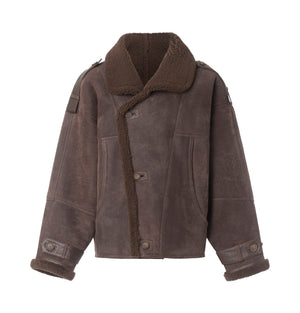Brown shearling jacket with a cozy collar and button closure, perfect for stylish warmth. Ideal for winter outings by MEOTINE.