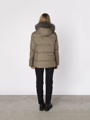 Stylish MEOTINE puffer jacket in olive green with a luxurious fur-lined hood, perfect for cold weather. Back view showcased.