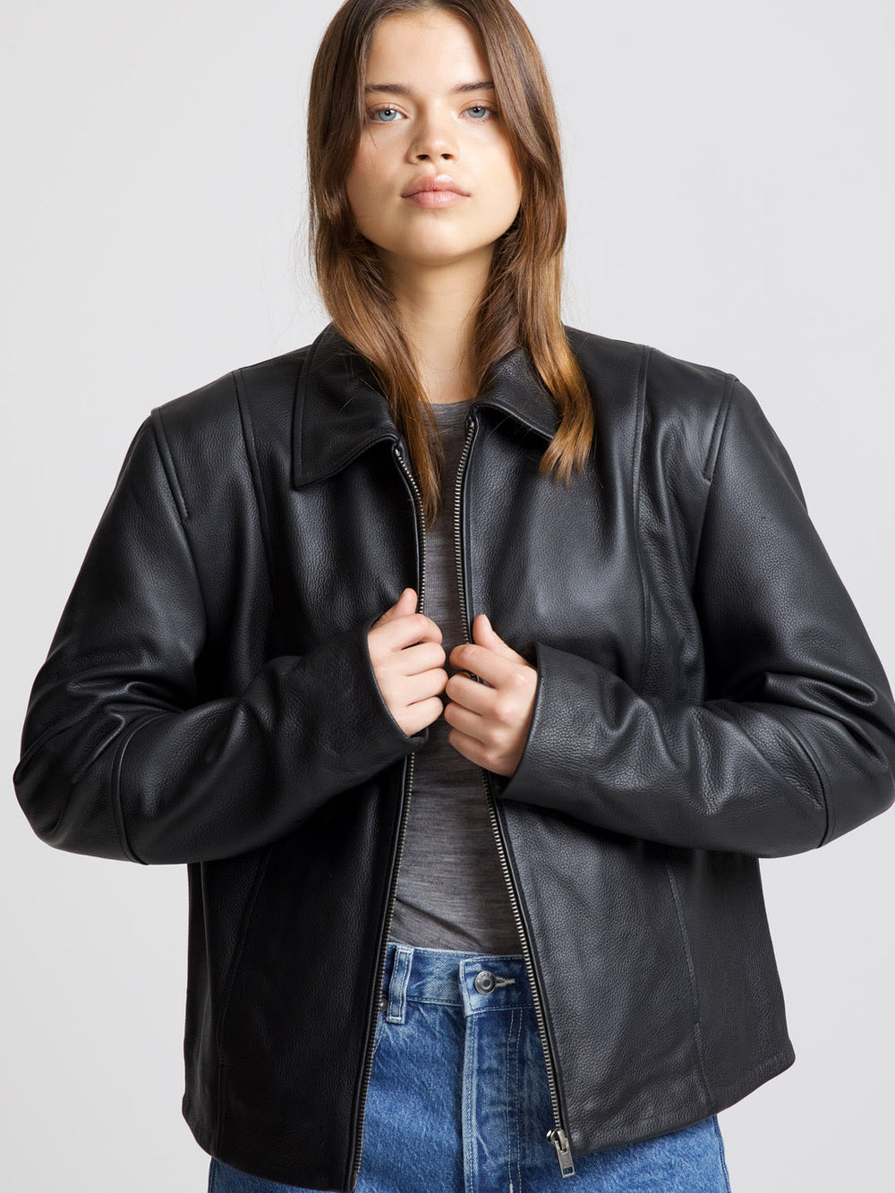 Stylish black leather jacket by MEOTINE, featuring a classic collar and a relaxed fit, perfect for a chic, casual look.