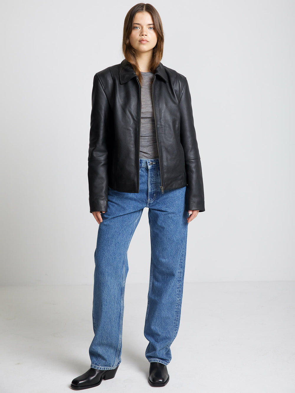 Stylish black leather jacket by MEOTINE, featuring a classic collar and a relaxed fit, perfect for a chic, casual look.