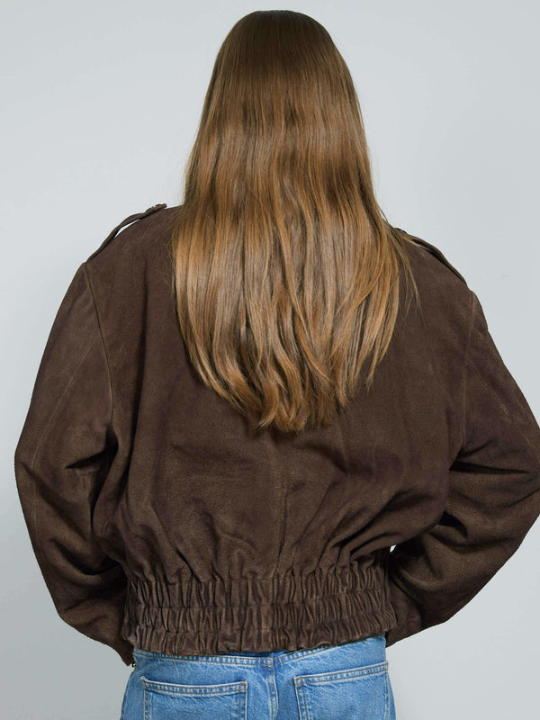 Brown cropped jacket with a cinched waist, featuring a relaxed fit and soft texture, perfect for a stylish, casual look by MEOTINE.