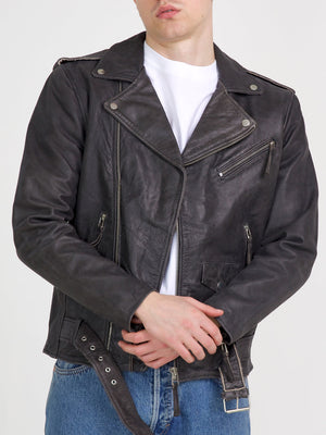 Stylish black leather biker jacket with a classic design, featuring zippers and a belted waist, perfect for a trendy look. MEOTINE.