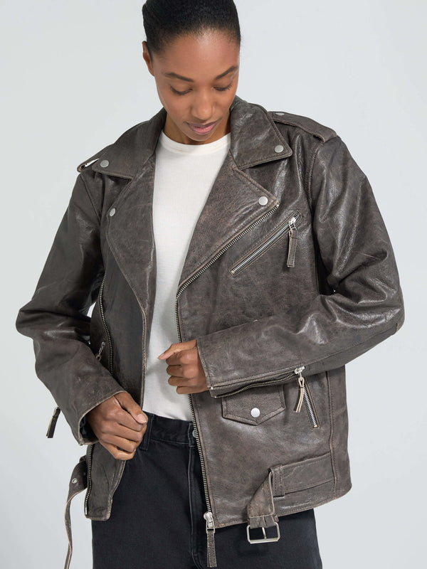 Stylish brown leather jacket with zippers and a relaxed fit, perfect for a trendy look. From MEOTINE's latest collection.