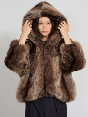 Luxurious brown faux fur hoodie with a large hood, featuring soft, plush texture, perfect for stylish warmth by MEOTINE.