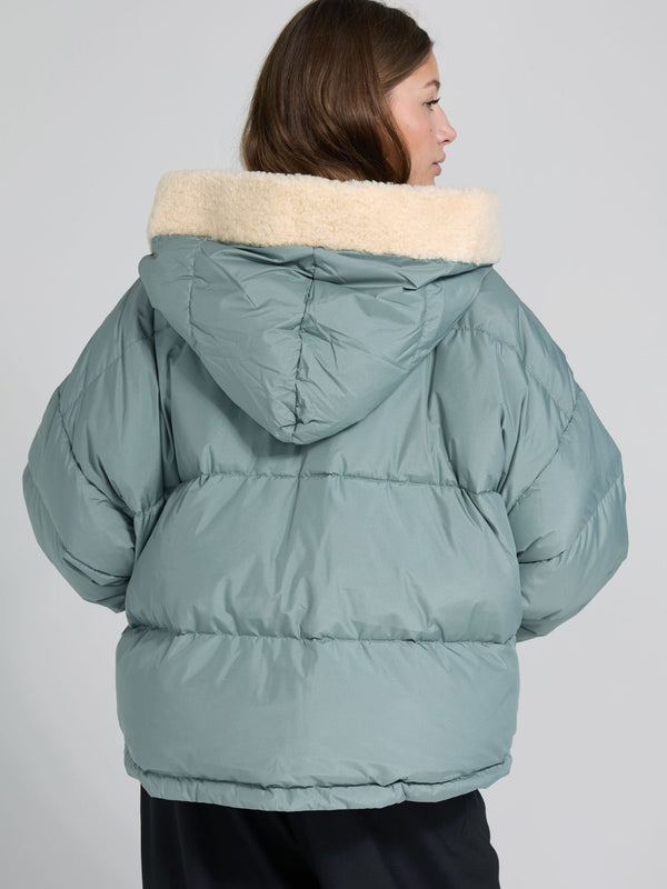 Cozy MEOTINE puffer jacket in soft green with a plush cream collar, featuring a relaxed fit and hood, perfect for chilly days.