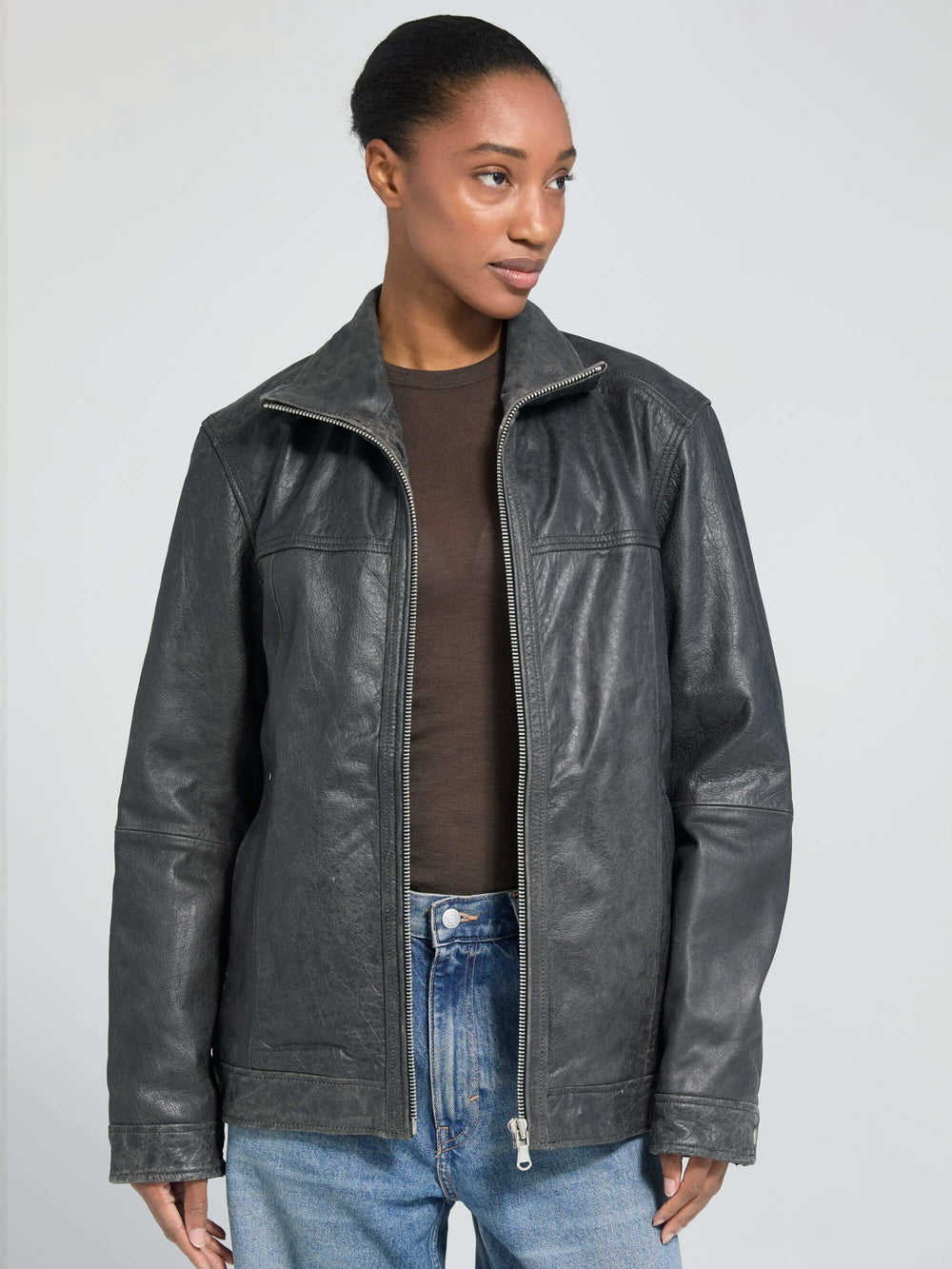 Stylish black leather jacket from MEOTINE, featuring a high collar and a relaxed fit, perfect for a chic, modern look.