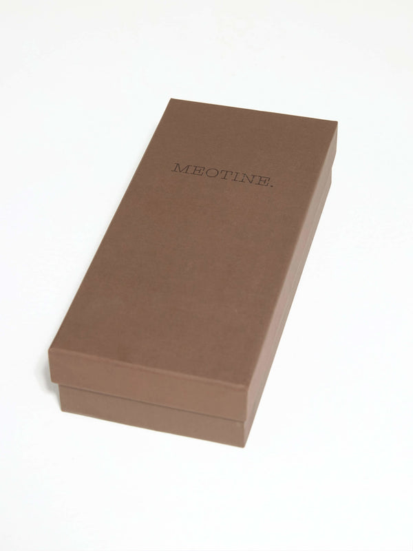 A sleek brown box with the brand name "MEOTINE" elegantly embossed on the top, perfect for gift packaging or storage.