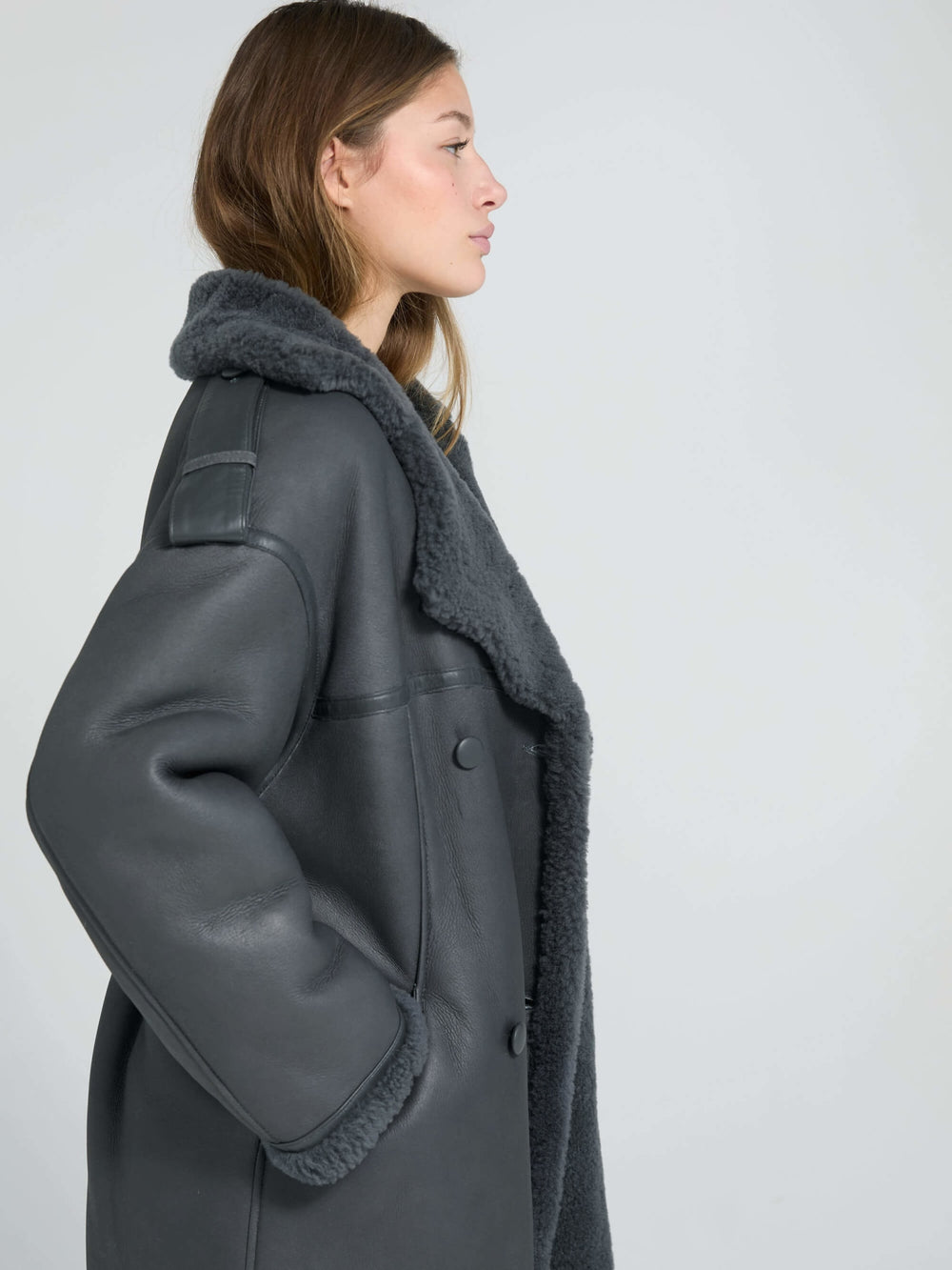 Stylish gray oversized coat with a plush collar, showcasing a modern silhouette, perfect for a chic winter look by MEOTINE.