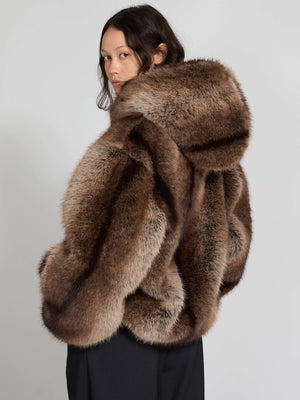 Luxurious brown faux fur coat with a hood, featuring a voluminous silhouette, perfect for stylish winter warmth by MEOTINE.