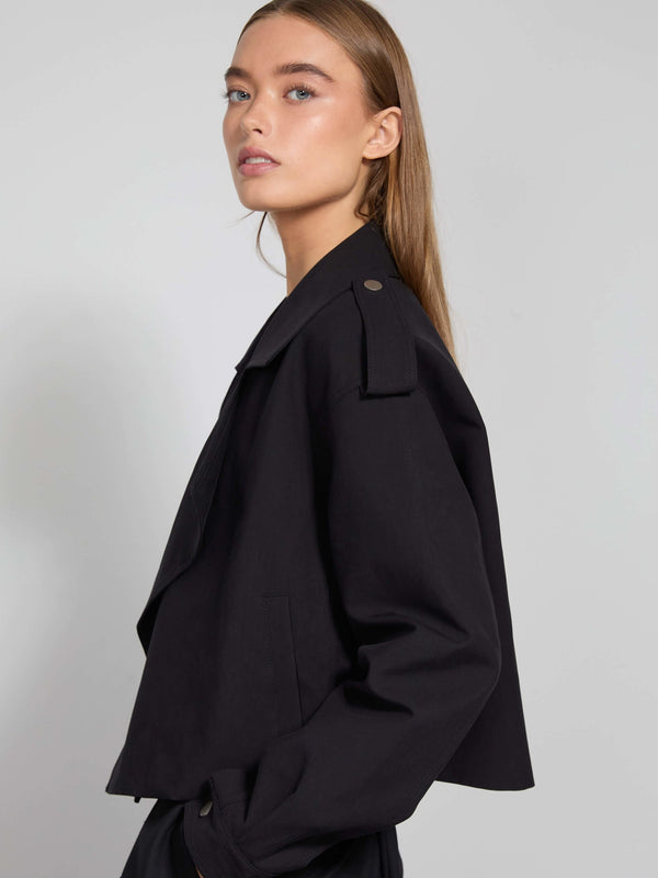 Stylish black cropped jacket with a relaxed fit, featuring a classic collar and button details, perfect for a chic look by MEOTINE.