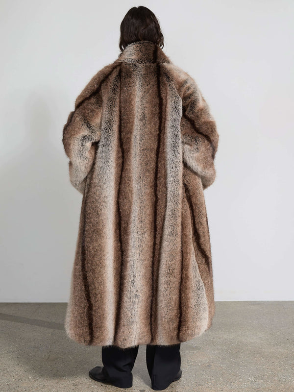 Luxurious oversized faux fur coat in a rich brown hue, featuring a plush texture and elegant silhouette by MEOTINE.