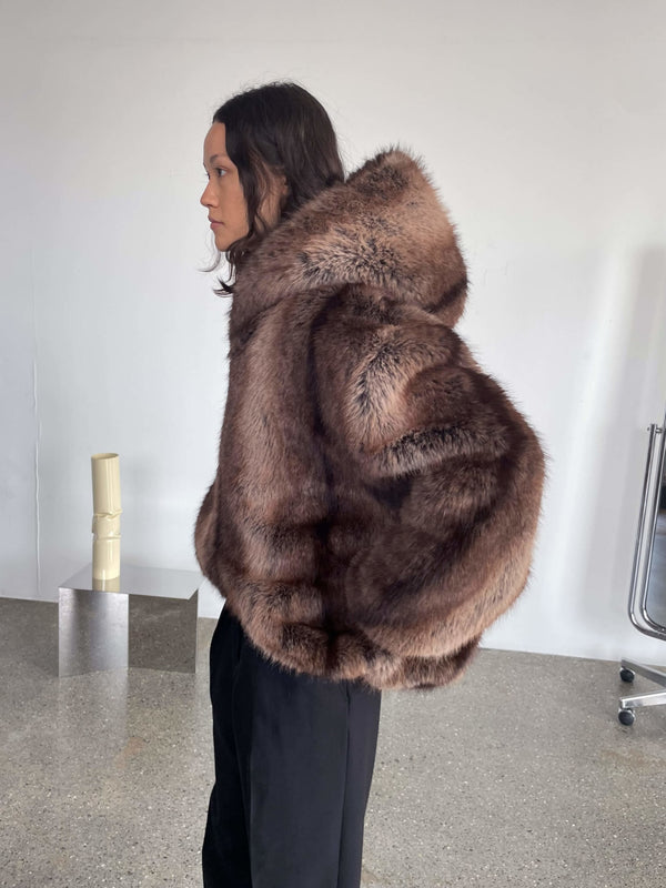 Luxurious brown faux fur coat with a hood, featuring a stylish silhouette, perfect for a chic winter look by MEOTINE.