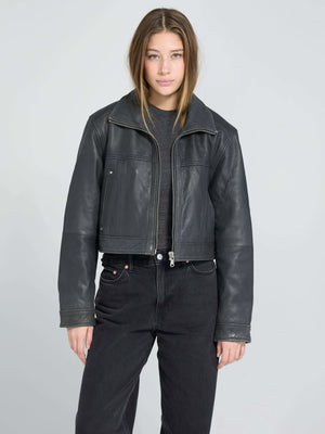 Stylish black leather cropped jacket from MEOTINE, featuring a classic collar and a relaxed fit, perfect for a chic look.