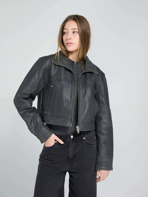 Stylish black leather cropped jacket from MEOTINE, featuring a zip closure and a modern, relaxed fit, perfect for any outfit.
