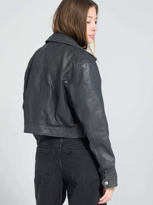 Stylish black leather cropped jacket from MEOTINE, featuring a classic collar and a fitted silhouette, perfect for a chic look.