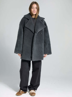 Cozy gray oversized coat with a double-breasted design, paired with relaxed black pants, showcasing MEOTINE's stylish warmth.