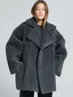 Cozy oversized gray faux fur coat by MEOTINE, featuring a wide collar and large buttons, perfect for stylish winter layering.