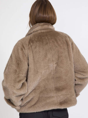 Cozy brown faux fur jacket with a relaxed fit, perfect for layering. Ideal for stylish warmth this season by MEOTINE.