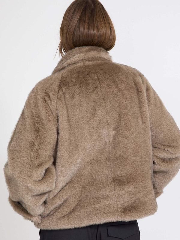 Cozy brown faux fur jacket with a relaxed fit, perfect for layering. Ideal for stylish warmth this season by MEOTINE.